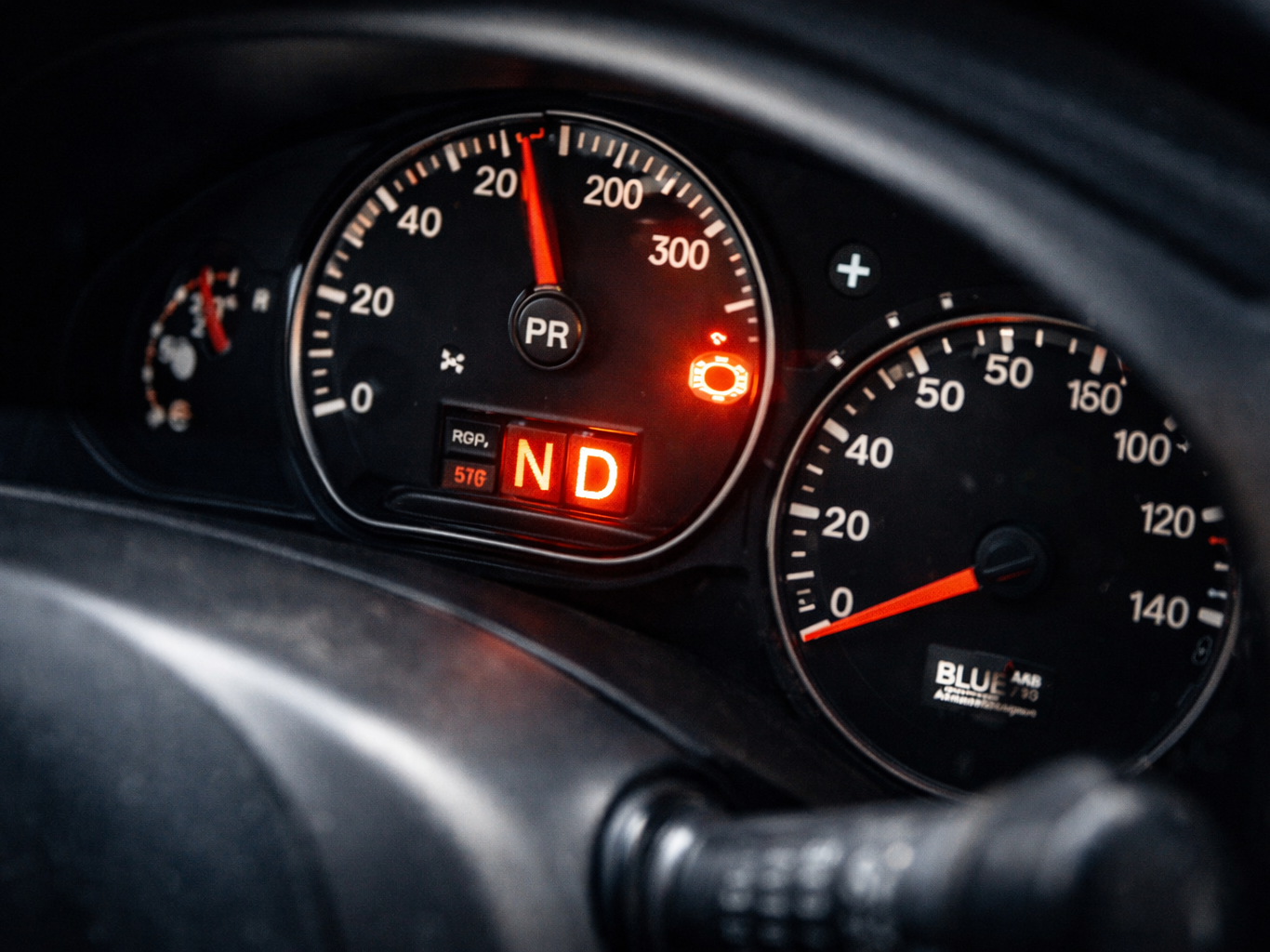 Vehicle instrument panel showing warning light related to drivetrain performance